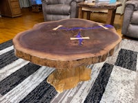 a coffee table made from a tree stump